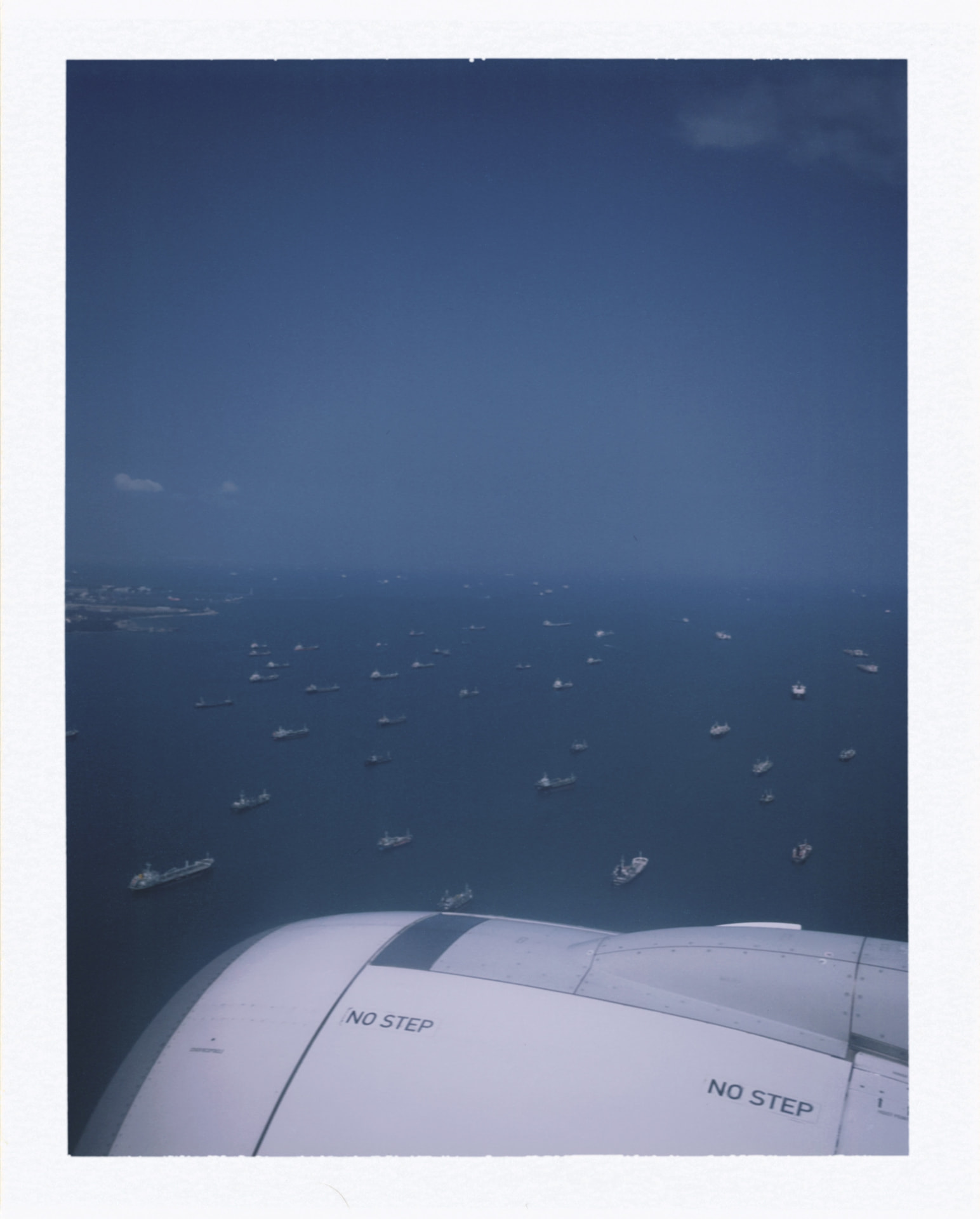 Airplane wing above the sea